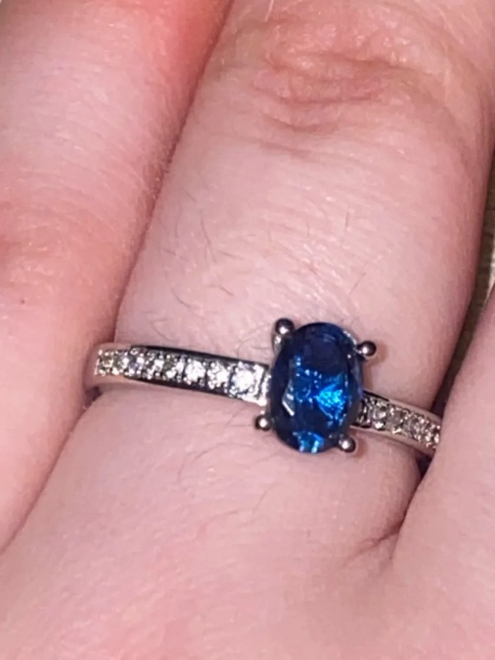 Blue Oval Solitaire Ring with Pavé Band
